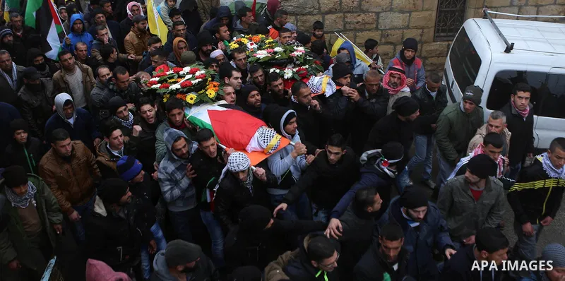 Palestinian mourners carry the bodies of Mansour al-Shawamrah, 20, and Omar Amr, 20 during their joint funeral in the West Bank village of al-Qubeiba, near Ramallah, Tuesday, Feb. 23, 2016. Israeli police said that the t...