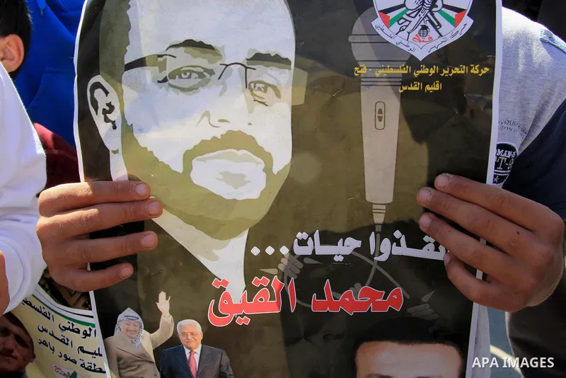 Palestinians take part in a protest to show solidarity with Mohammed al-Qiq a Palestinian hunger strike journalist, who is imprisoned in an Israeli jail, on February 26, 2016 in Jerusalem. Imprisoned Palestinian hunger-s...