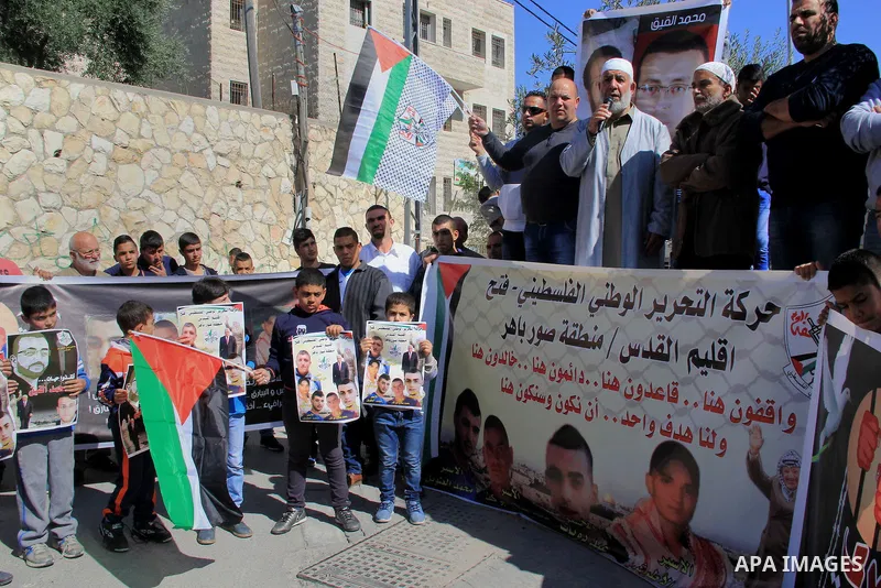 Palestinians take part in a protest to show solidarity with Mohammed al-Qiq a Palestinian hunger strike journalist, who is imprisoned in an Israeli jail, on February 26, 2016 in Jerusalem. Imprisoned Palestinian hunger-s...