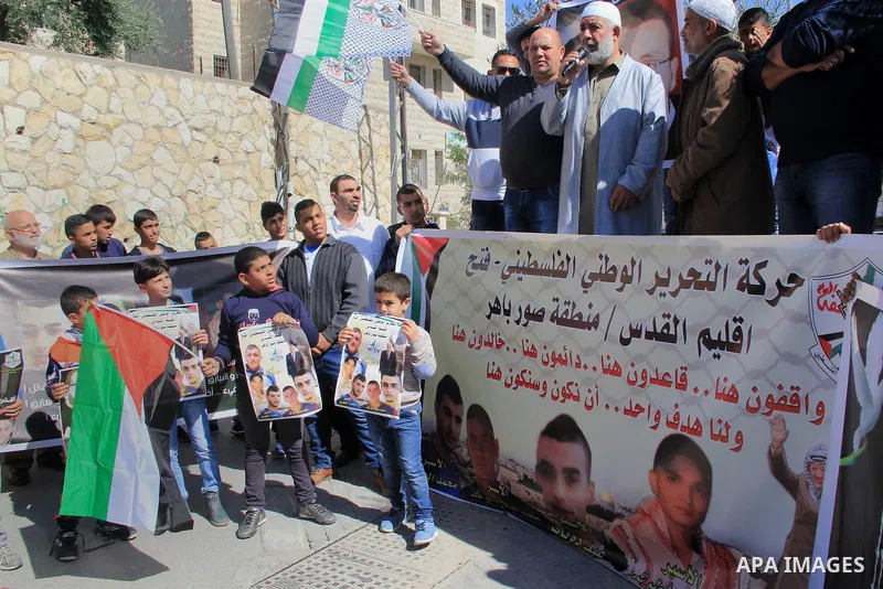Palestinians take part in a protest to show solidarity with Mohammed al-Qiq a Palestinian hunger strike journalist, who is imprisoned in an Israeli jail, on February 26, 2016 in Jerusalem. Imprisoned Palestinian hunger-s...