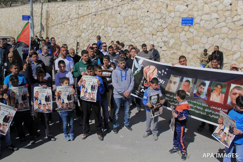 Palestinians take part in a protest to show solidarity with Mohammed al-Qiq a Palestinian hunger strike journalist, who is imprisoned in an Israeli jail, on February 26, 2016 in Jerusalem. Imprisoned Palestinian hunger-s...