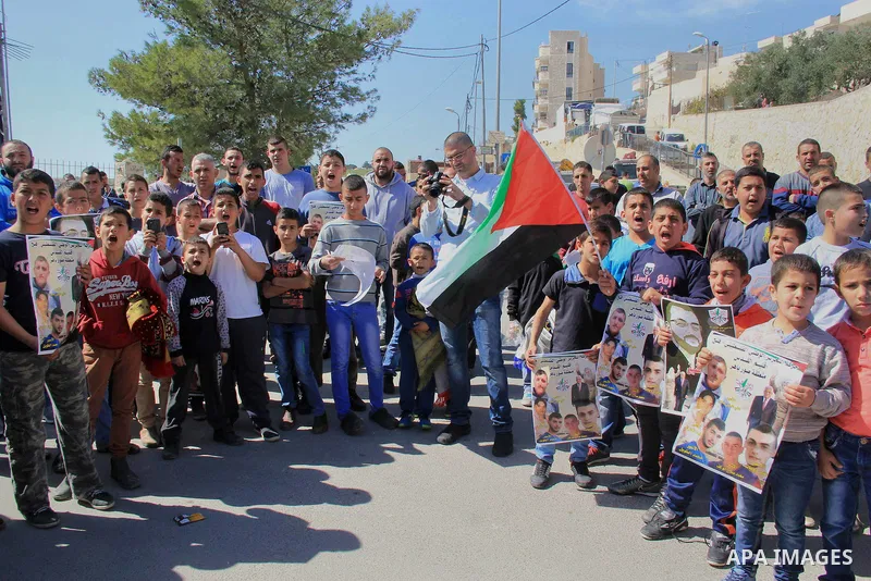 Palestinians take part in a protest to show solidarity with Mohammed al-Qiq a Palestinian hunger strike journalist, who is imprisoned in an Israeli jail, on February 26, 2016 in Jerusalem. Imprisoned Palestinian hunger-s...