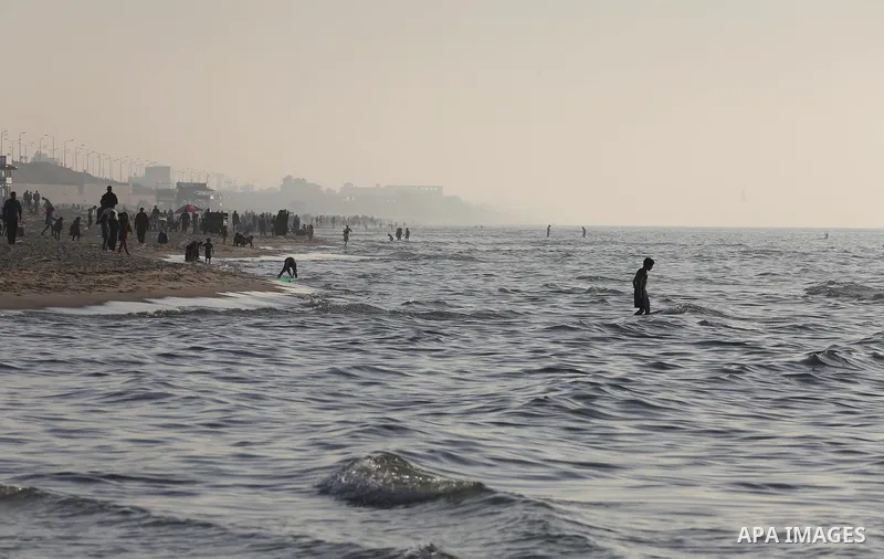 Palestinians enjoy their time at the beach of Gaza city during sunset on Feb. 26, 2016. Photo by Mohammed Asad