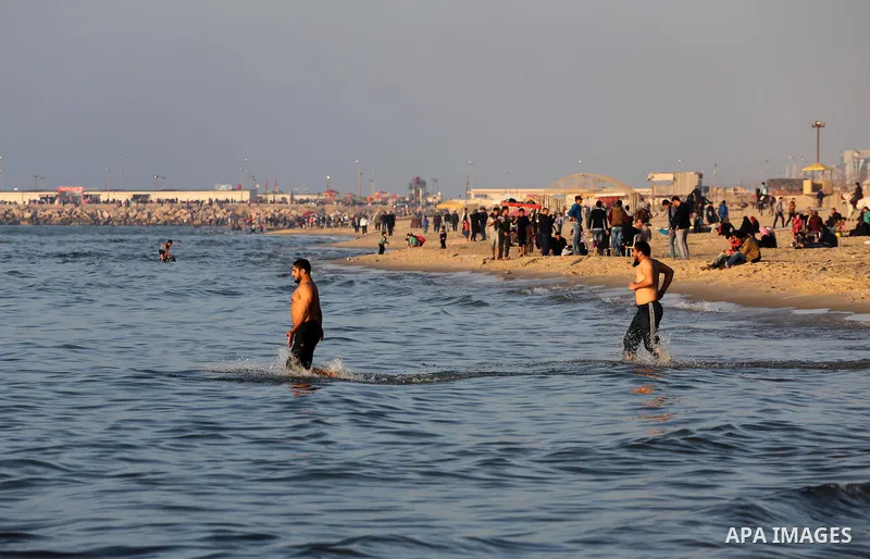 Palestinians enjoy their time at the beach of Gaza city during sunset on Feb. 26, 2016. Photo by Mohammed Asad