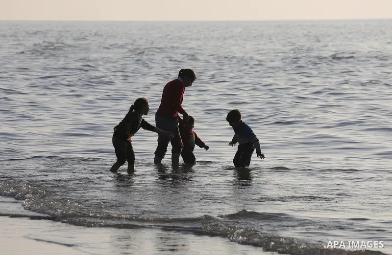 Palestinians enjoy their time at the beach of Gaza city during sunset on Feb. 26, 2016. Photo by Mohammed Asad