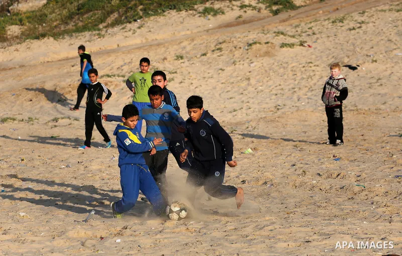 Palestinians enjoy their time at the beach of Gaza city during sunset on Feb. 26, 2016. Photo by Mohammed Asad