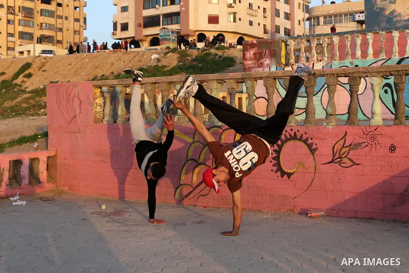 Palestinians enjoy their time at the beach of Gaza city during sunset on Feb. 26, 2016. Photo by Mohammed Asad