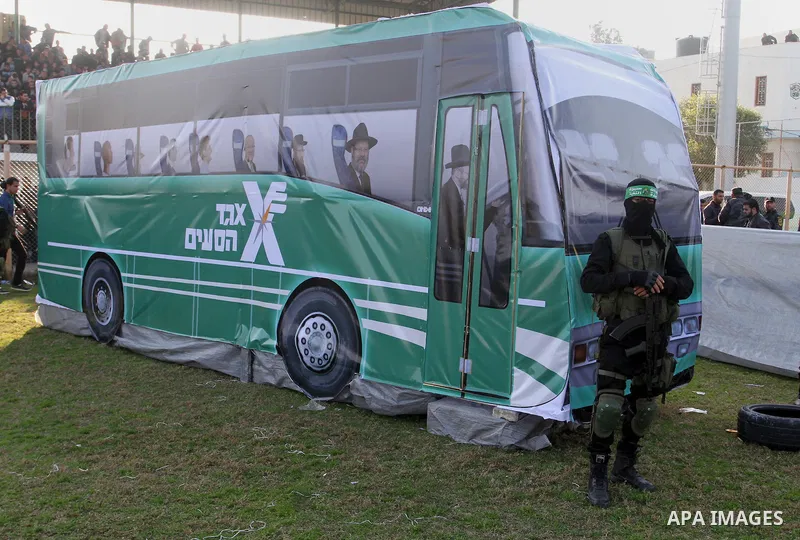 Palestinian militants of the Ezzedine al-Qassam Brigades, the armed wing of the Hamas movement, take part in an anti-Israel rally on February 26, 2016, in the southern Gaza Strip town of Rafah. Photo by Abed Rahim Khatib