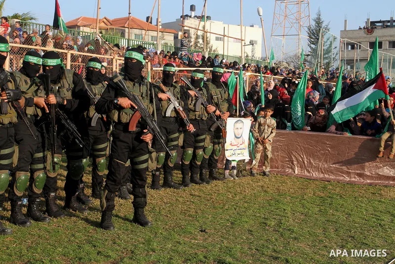 Palestinian militants of the Ezzedine al-Qassam Brigades, the armed wing of the Hamas movement, take part in an anti-Israel rally on February 26, 2016, in the southern Gaza Strip town of Rafah. Photo by Abed Rahim Khatib