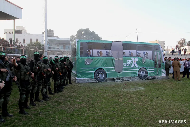 Palestinian militants of the Ezzedine al-Qassam Brigades, the armed wing of the Hamas movement, take part in an anti-Israel rally on February 26, 2016, in the southern Gaza Strip town of Rafah. Photo by Abed Rahim Khatib