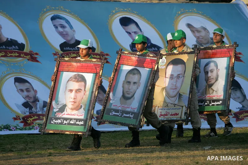 Palestinian boys take part during a show as part of an anti-Israel rally on February 26, 2016, in the southern Gaza Strip town of Rafah. Photo by Abed Rahim Khatib