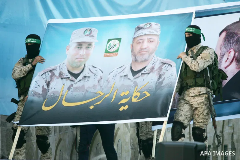 Palestinian militants of the Ezzedine al-Qassam Brigades, the armed wing of the Hamas movement, take part in an anti-Israel rally on February 26, 2016, in the southern Gaza Strip town of Rafah. Photo by Abed Rahim Khatib