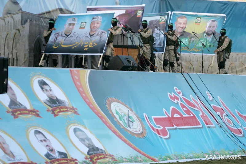 Palestinian militants of the Ezzedine al-Qassam Brigades, the armed wing of the Hamas movement, take part in an anti-Israel rally on February 26, 2016, in the southern Gaza Strip town of Rafah. Photo by Abed Rahim Khatib