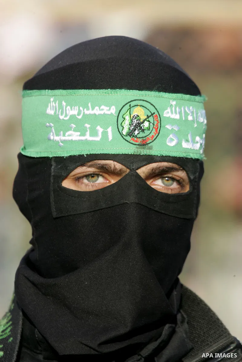 Palestinian militants of the Ezzedine al-Qassam Brigades, the armed wing of the Hamas movement, take part in an anti-Israel rally on February 26, 2016, in the southern Gaza Strip town of Rafah. Photo by Abed Rahim Khatib