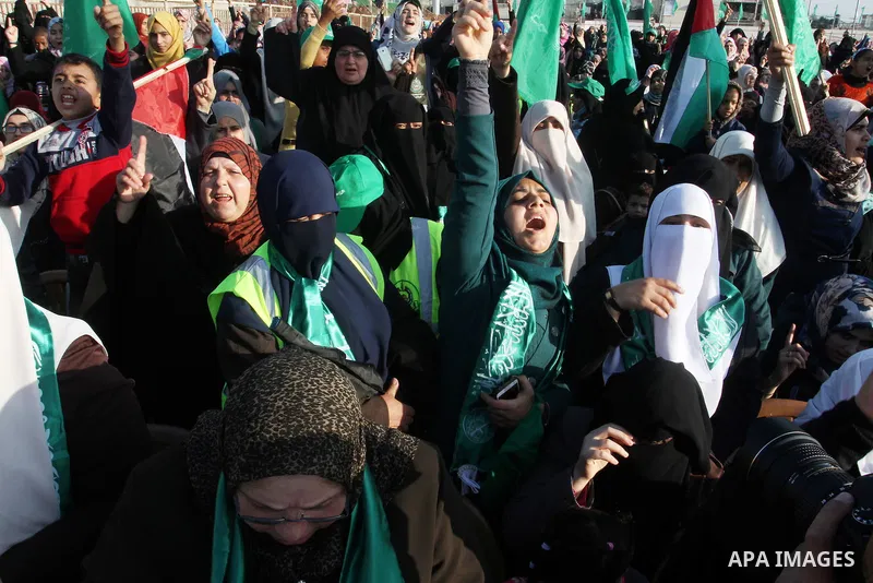 Palestinian supporters of the Hamas islamist movement shout slogans during an anti-Israel rally on February 26, 2016, in the southern Gaza Strip town of Rafah. Photo by Abed Rahim Khatib