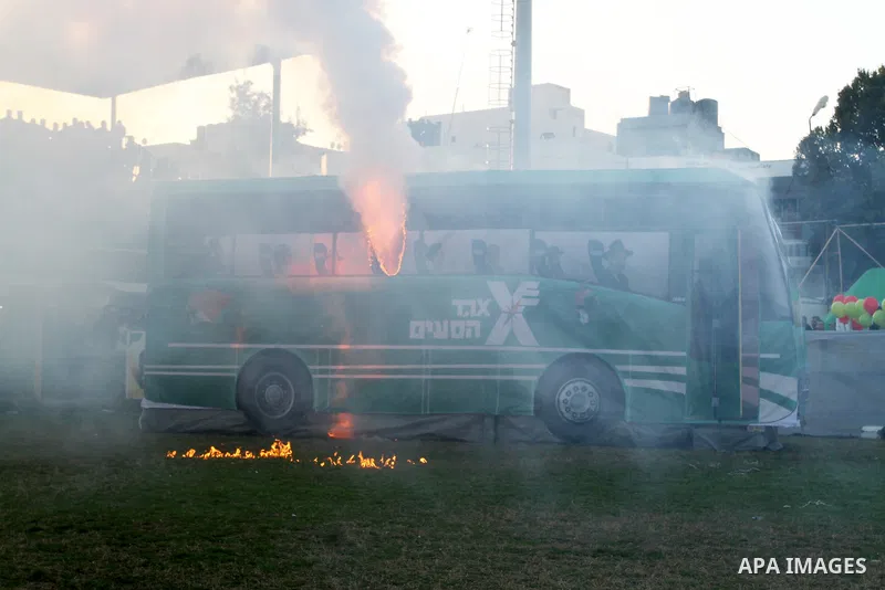 A mock Israeli bus is seen on fire during a show as part of an anti-Israel rally on February 26, 2016, in the southern Gaza Strip town of Rafah. Photo by Abed Rahim Khatib