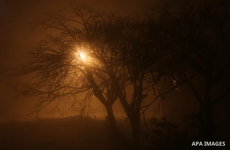 Palestinians walk at a street during foggy weather in Gaza City, The Gaza Strip, 27 February 2016. Photo by Mohammed Asad