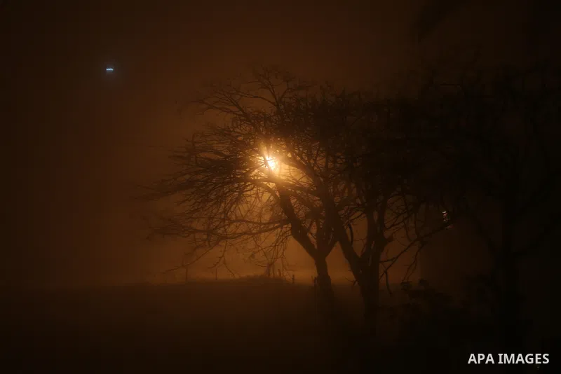 Palestinians walk at a street during foggy weather in Gaza City, The Gaza Strip, 27 February 2016. Photo by Mohammed Asad