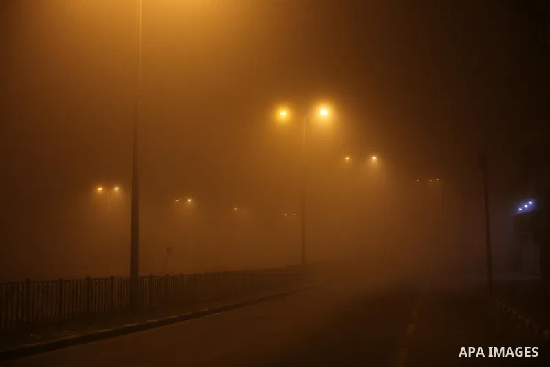 Palestinians walk at a street during foggy weather in Gaza City, The Gaza Strip, 27 February 2016. Photo by Mohammed Asad