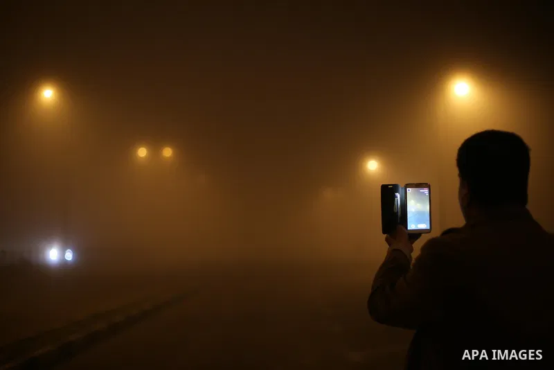 A Palestinian man takes a selfie at a street during foggy weather in Gaza City, The Gaza Strip, 27 February 2016. Photo by Mohammed Asad