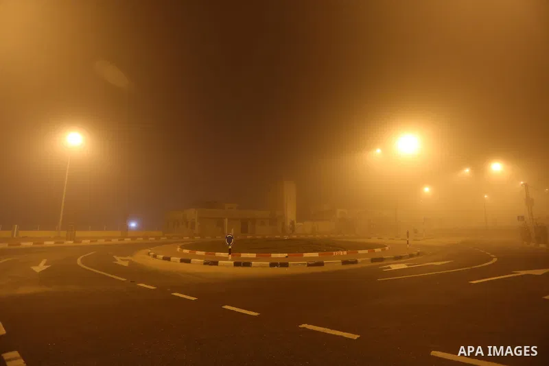 Palestinians walk at a street during foggy weather in Gaza City, The Gaza Strip, 27 February 2016. Photo by Mohammed Asad
