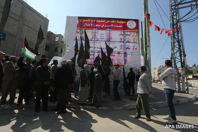 Palestinians take part in a protest demanding release the prisoners in Israeli jails, in Gaza city, on February 28, 2016. Photo by Mohammed Asad