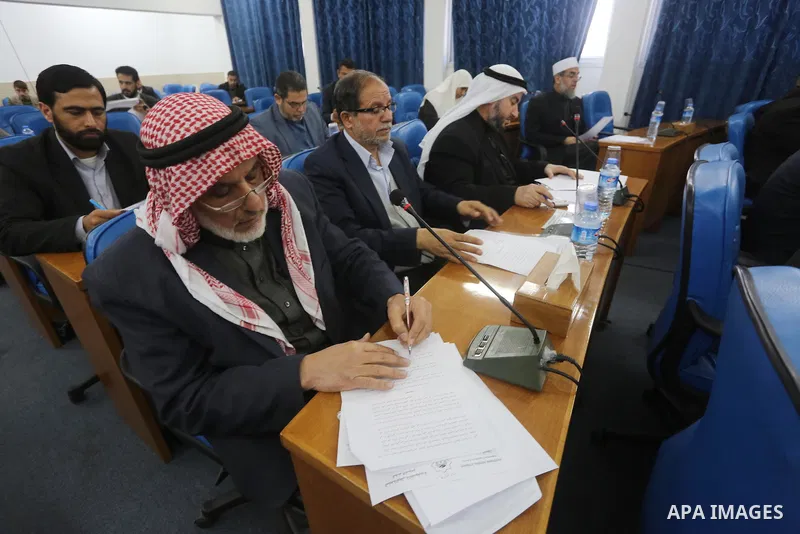 Members of the Palestinian legislative council from Hamas movement attend a meeting at the legislative council, in Gaza city, on February 28, 2016. Photo by Mohammed Asad