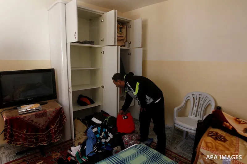 A Palestinian man checks his belongings after a raid conducted by the Israeli army on some Palestinian houses in the West Bank city of Hebron, 29 February 2016. The Israeli army said it had arrested 16 Palestinians in He...