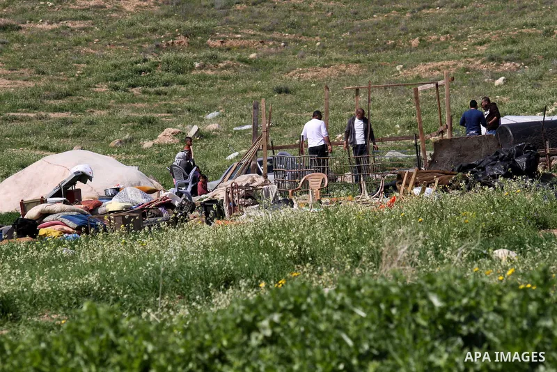 Palestinian men inspect the rubble of their tent that were demolished by the Israeli army, in the West Bank town of Tubas on February 29, 2016. Israel is planning to annex the Jordan Valley into a completely Israeli area...