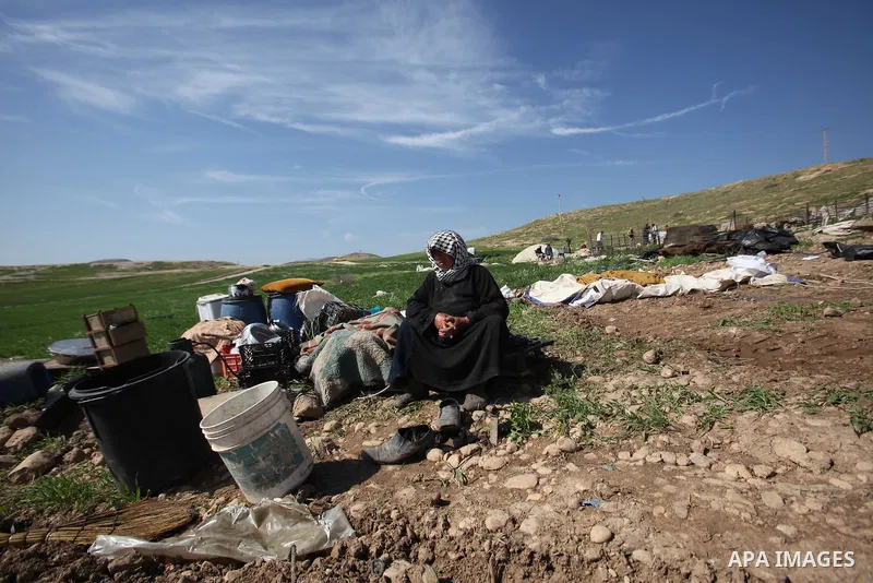 A Palestinian woman inspects the rubble of her tent that was demolished by the Israeli army, in the West Bank town of Tubas on February 29, 2016. Israel is planning to annex the Jordan Valley into a completely Israeli ar...