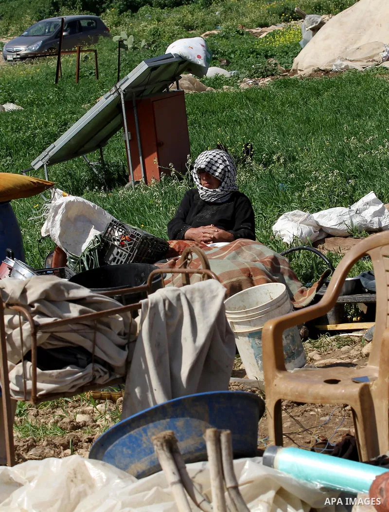 A Palestinian woman inspects the rubble of her tent that was demolished by the Israeli army, in the West Bank town of Tubas on February 29, 2016. Israel is planning to annex the Jordan Valley into a completely Israeli ar...