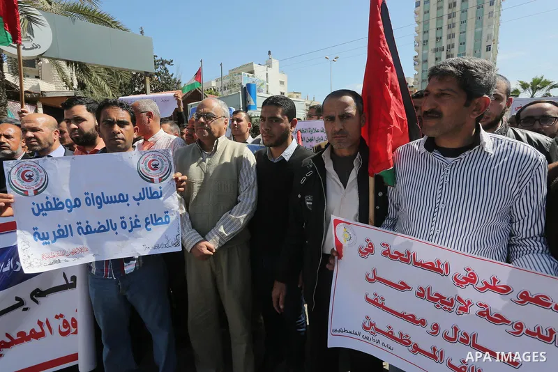 Employees of former Palestinian government take part in a protest to demand for pay their salaries, in Gaza city on March 1, 2016. Photo by Mohammed Asad