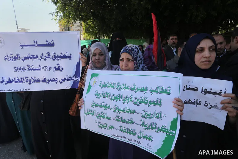 Employees of former Palestinian government take part in a protest to demand for pay their salaries, in Gaza city on March 1, 2016. Photo by Mohammed Asad