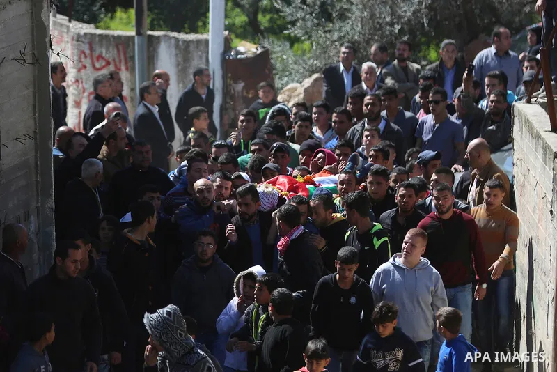 Mourners carry the body of 22-year-old Palestinian man Eyad Sajedeya, who medics said was shot dead by Israeli forces, during his funeral at Qalandia refugee camp near the West Bank city of Ramallah March 1, 2016. Israel...