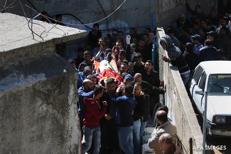 Mourners carry the body of 22-year-old Palestinian man Eyad Sajedeya, who medics said was shot dead by Israeli forces, during his funeral at Qalandia refugee camp near the West Bank city of Ramallah March 1, 2016. Israel...