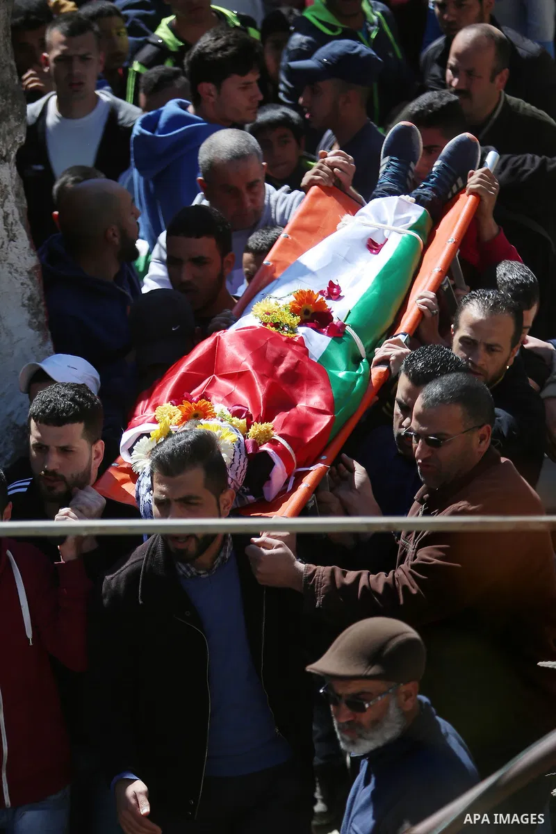 Mourners carry the body of 22-year-old Palestinian man Eyad Sajedeya, who medics said was shot dead by Israeli forces, during his funeral at Qalandia refugee camp near the West Bank city of Ramallah March 1, 2016. Israel...