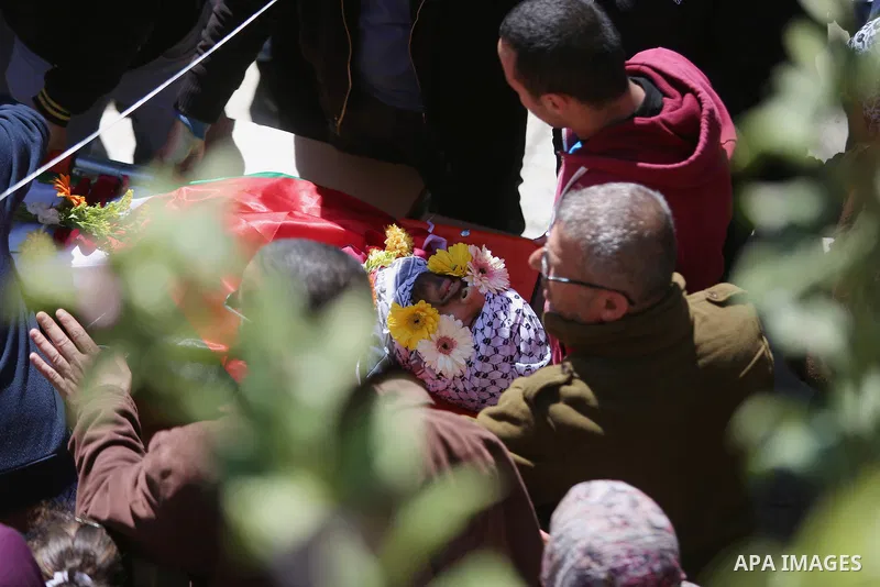 Mourners carry the body of 22-year-old Palestinian man Eyad Sajedeya, who medics said was shot dead by Israeli forces, during his funeral at Qalandia refugee camp near the West Bank city of Ramallah March 1, 2016. Israel...