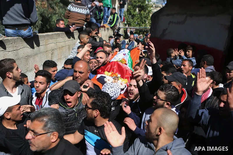 Mourners carry the body of 22-year-old Palestinian man Eyad Sajedeya, who medics said was shot dead by Israeli forces, during his funeral at Qalandia refugee camp near the West Bank city of Ramallah March 1, 2016. Israel...