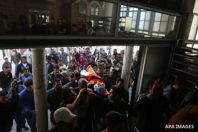 Mourners carry the body of 22-year-old Palestinian man Eyad Sajedeya, who medics said was shot dead by Israeli forces, during his funeral at Qalandia refugee camp near the West Bank city of Ramallah March 1, 2016. Israel...