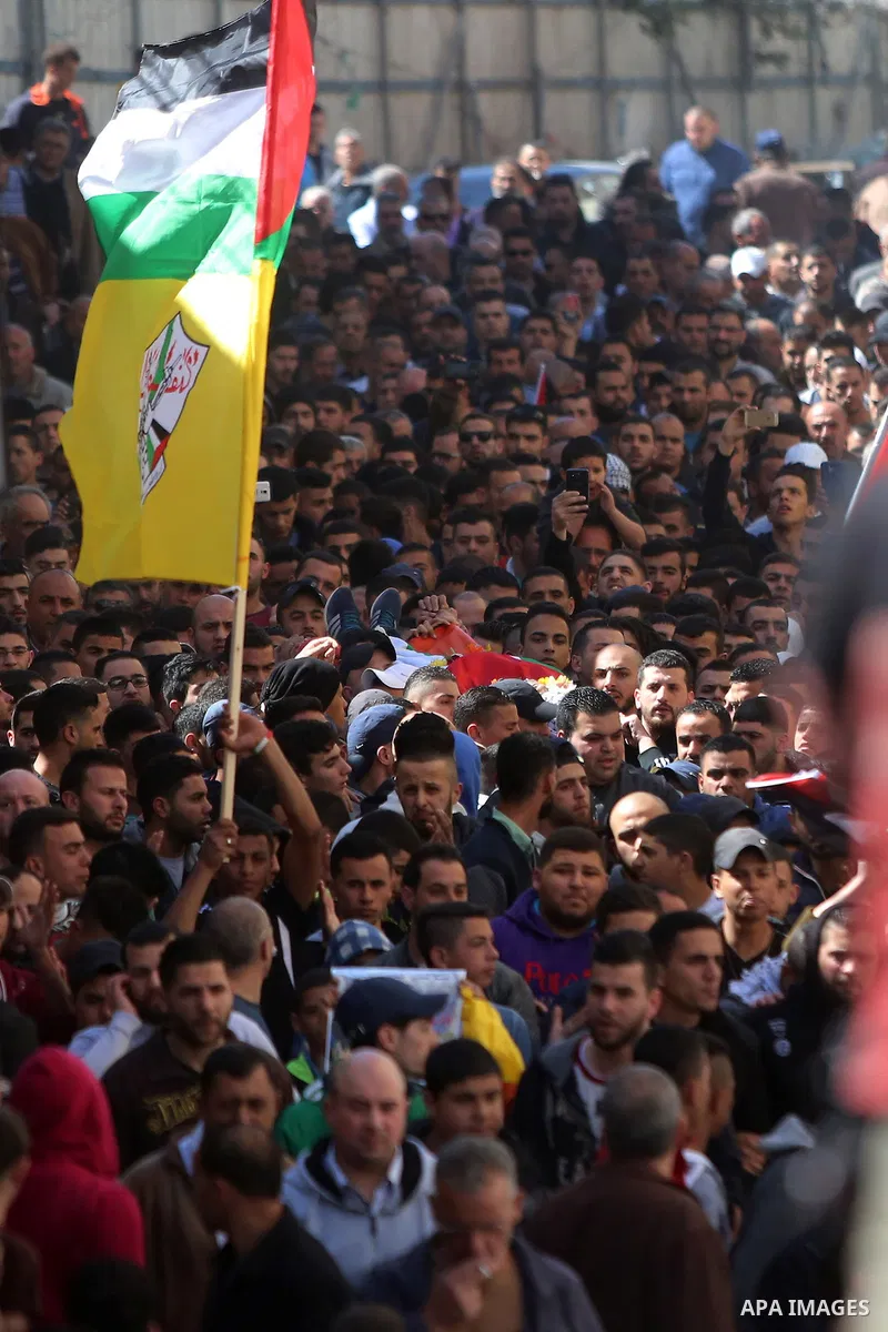 Mourners carry the body of 22-year-old Palestinian man Eyad Sajedeya, who medics said was shot dead by Israeli forces, during his funeral at Qalandia refugee camp near the West Bank city of Ramallah March 1, 2016. Israel...
