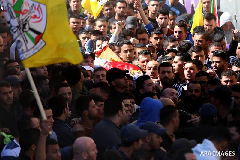 Mourners carry the body of 22-year-old Palestinian man Eyad Sajedeya, who medics said was shot dead by Israeli forces, during his funeral at Qalandia refugee camp near the West Bank city of Ramallah March 1, 2016. Israel...