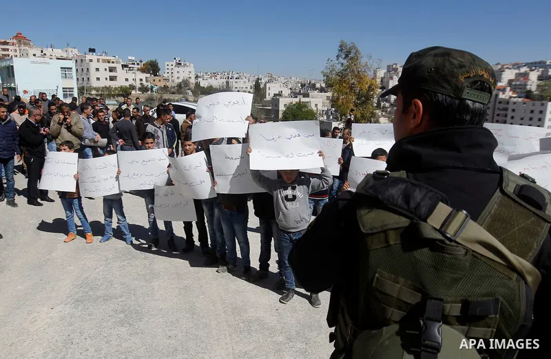 Palestinian school students take part during a protest to show solidarity with Palestinian teachers in their strike wihch entered its 16th consecutive day to call Palestinian Authority to demand their rights in the West...