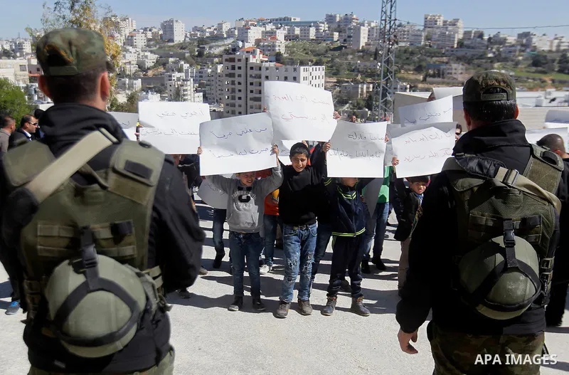 Palestinian school students take part during a protest to show solidarity with Palestinian teachers in their strike wihch entered its 16th consecutive day to call Palestinian Authority to demand their rights in the West...