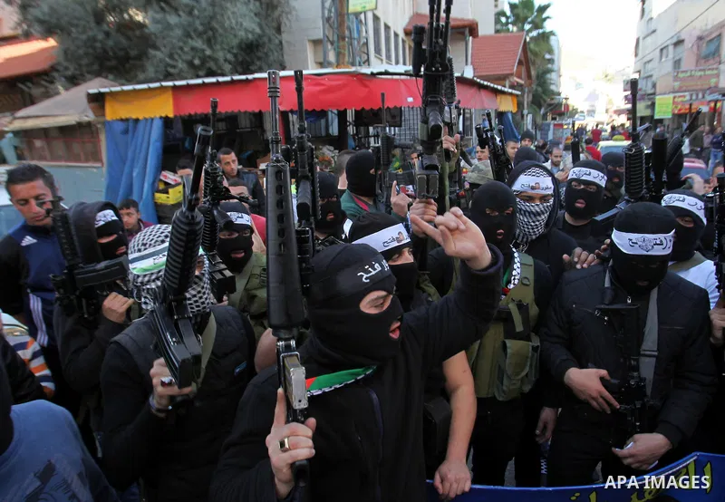Palestinian militants of Al-Aqsa Martyrs' Brigades, a group linked to the Fatah movement take part during a protest to show solidarity with Palestinian President Mahmoud Abbas and Palestinian Prime Minister Rami Hamdalla...