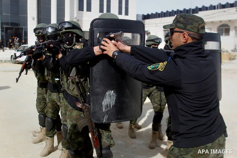 Members of Palestinian national security forces show their skills during a military training, in the West Bank city of Hebron, on March 2, 2016. Photo by Wisam Hashlamoun