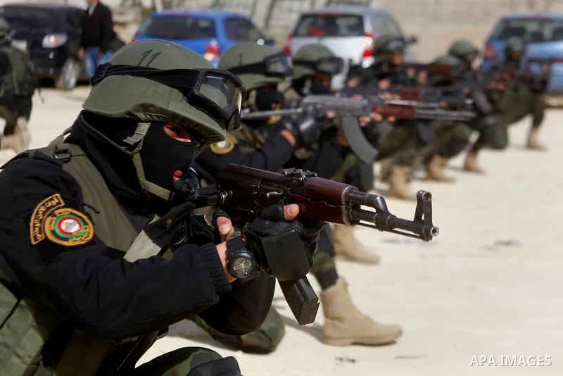 Members of Palestinian national security forces show their skills during a military training, in the West Bank city of Hebron, on March 2, 2016. Photo by Wisam Hashlamoun