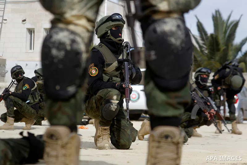 Members of Palestinian national security forces show their skills during a military training, in the West Bank city of Hebron, on March 2, 2016. Photo by Wisam Hashlamoun
