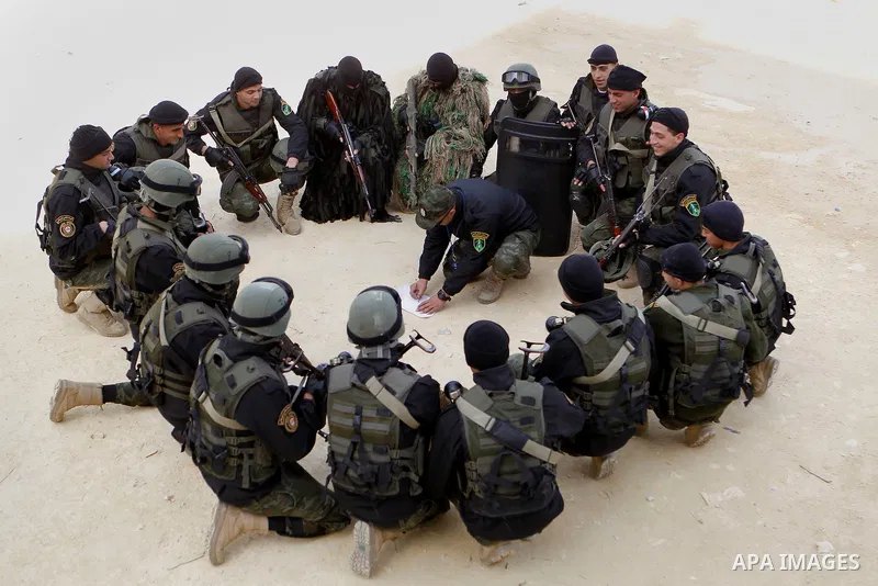 Members of Palestinian national security forces show their skills during a military training, in the West Bank city of Hebron, on March 2, 2016. Photo by Wisam Hashlamoun