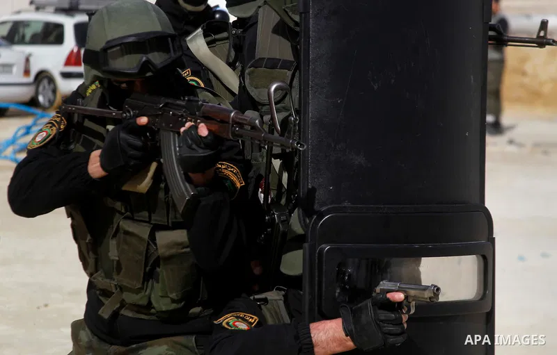 Members of Palestinian national security forces show their skills during a military training, in the West Bank city of Hebron, on March 2, 2016. Photo by Wisam Hashlamoun