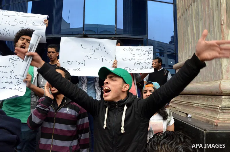 Egyptians hold placards during a demonstration to protest against the normalizing Israeli-Egyptian relations in front of journalists syndicate in Cairo, Egypt, on March 02, 2016. Photo by Amr Sayed
